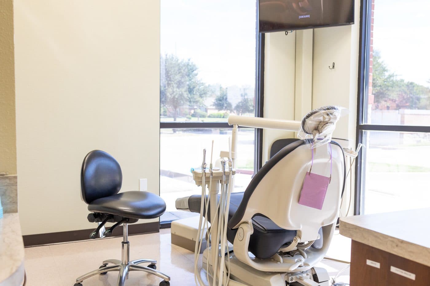 A treatment room at Soleil Dental Mesquite with the dental chair by a big window