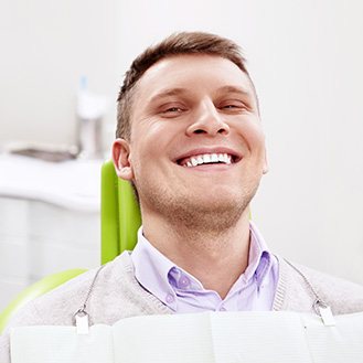 patient in dental chair smiling