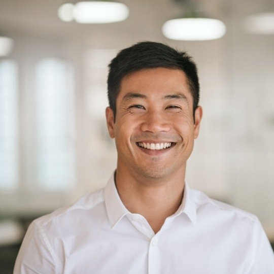 man in white shirt smiling